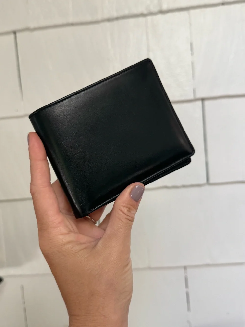 Polo Ralph Lauren bi-fold leather wallet in black featuring a debossed logo